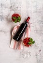 Pomegranate salad decorated with parsley and bottle of red wine with glasses top view flat lay Royalty Free Stock Photo