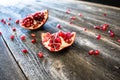 Pomegranate with scattered seeds Royalty Free Stock Photo