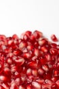 Pomegranate seeds on white background Punica granatum