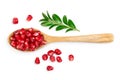 Pomegranate seeds in wooden spoon isolated on white background with clipping path and full depth of field. Top view Royalty Free Stock Photo