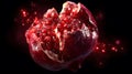 Pomegranate Segment Exploding With Red Arils Against a Dark Background Royalty Free Stock Photo