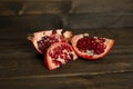 The pomegranate slices lie on a dark background Royalty Free Stock Photo