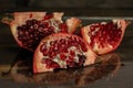 The pomegranate slices lie on a dark background Royalty Free Stock Photo