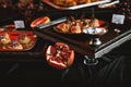 Pomegranate and snacks on catering table Royalty Free Stock Photo