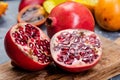 Pomegranate Tropical Fruit Cut in Half on Wooden Board