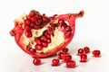 Pomegranate on a white background with grains