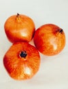 Pomegranate (Punica granatum) fruit three red ripe fresh whole anaar rodie nar melograno anor grenadefruit image photo