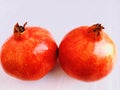 Pomegranate (Punica granatum) fruit two red ripe fresh whole anaar rodie nar melograno anor grenadefruit Royalty Free Stock Photo