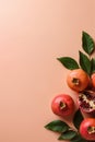 Ripe red pomegranates on a coral background