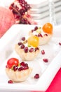 Pomegranates and cream cheese canapes Royalty Free Stock Photo