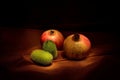 Pomegranates and green gourds Royalty Free Stock Photo