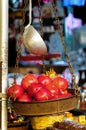 Pomegranates inside an old metal weighing scale. Royalty Free Stock Photo