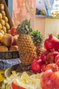 Pomegranates, pineapple, and apples at a market in Jammu and Kashmir Royalty Free Stock Photo