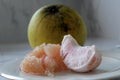 Pomelo fruit on plate. Grapefruit, jeruk Bali, or Bali pomelo fruit. Large oranges in Indonesia are known as Bali oranges.