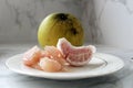 Pomelo fruit on plate. Grapefruit, jeruk Bali, or Bali pomelo fruit. Large oranges in Indonesia are known as Bali oranges.