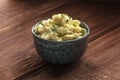 Pomme puree, a photo of a bowl of mashed potatoes with herbs on a dark rustic background