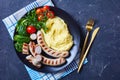 Pommes aligot with sausage and fresh salad Royalty Free Stock Photo