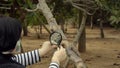 Pomologist looking at fig trunk