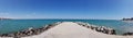 Pomorie / Bulgaria - july 18, 2019: Panorama landscape view of pier covered with breakwaters around, which protects the beach Royalty Free Stock Photo