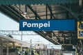 Pompei, Italy - August 10, 2019: City name of Pompei in train staion of Pompei