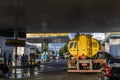 Tanker truck fills the reservoirs with fuel at a gas station