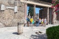 Pompeii, Company, Italy - June 25, 2019: A group of tourists inspects the ruins of the ancient city