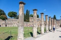 Pompeii, Company, Italy - June 25, 2019: Tourists walk between the stone columns of the ruined ancient city of Pompeii