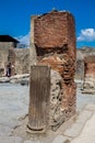 Tourists visiting the ruins of the houses of the ancient city of Pompeii