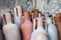 Pompeii, Italy, June 26, 2020 amphorae in an ancient warehouse Royalty Free Stock Photo