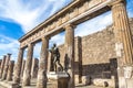 Pompeii in Italy, ruins of the antique Temple of Apollo with bronze Apollo statue, Naples Royalty Free Stock Photo