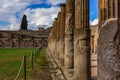 Pompeii ruins: stone columns at archeological site Royalty Free Stock Photo