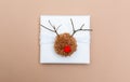 Pompom reindeer gift box on brown paper