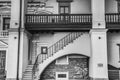 Pompous building facade of the Palace Grand Dukes of Lithuania features stairs on an arch below a balcony with wooden handrail Royalty Free Stock Photo