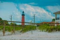 Partial view of Ponce Inlet lighthouse from beach
