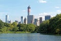 Pond in the central park in NYC. Central Park and Manhattan Skyline. Midtown Manhattan skyline viewed from Central Park