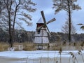 A pond covered with ice and covered with snow in Kalety Zielona, Poland. Visible windmill on the island Royalty Free Stock Photo