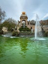 Pond and Fountain cascades with Stone arch, staircases and golden sculptures in Parc Ciutadella, Barcelona, Spain