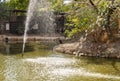 Pond with a fountain in Gan Guru kangaroo park in Kibutz Nir David in the north of Israel