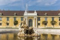 Pond with fountain and statue in the courtard of Schonbrunn palace in Vienna