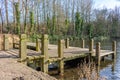 Pond with jetty, Reddish Vale, Cheshire, UK