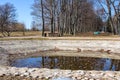 A pond in Kolomenskoye park and trees with no leaves in early spring. Royalty Free Stock Photo