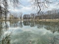 Pond in Lefortovo Park in spring in cloudy weather. Moscow