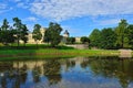 The pond and palace in Gatchina garden. Royalty Free Stock Photo