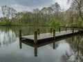 Pond with small jetty, Reddish Vale, Stockport, UK