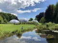 Pond or Teich and Tropenhaus - Botanical Garden of the University of Zurich or Botanischer Garten der Universitaet Zuerich Royalty Free Stock Photo