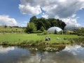 Pond or Teich and Tropenhaus - Botanical Garden of the University of Zurich or Botanischer Garten der Universitaet Zuerich Royalty Free Stock Photo