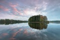 Pond with a tiny round island. Calm Water Of Lake, River, Forest On Other Side. Landscape. Mountain valley lake Royalty Free Stock Photo