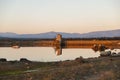 Pond of water in the dehesa of Extremadura at sunset in winter at sunset