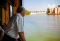 Pondering Old Man Thinking While Looking Outside Glass Window Royalty Free Stock Photo