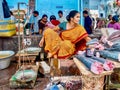 A fishmonger selling tuna at an Indian market.